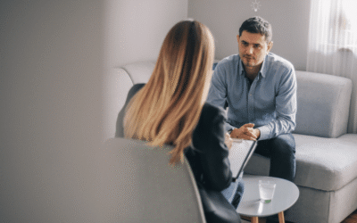 HR leader discussing outplacement support with an employee during organisational restructuring.
